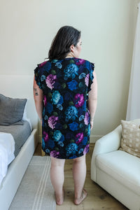 plus size dark hair woman standing in flutter sleeve bamboo nightgown floral print navy colour