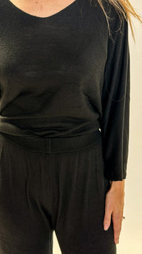 women wearing matching top and bottom knit set black colour